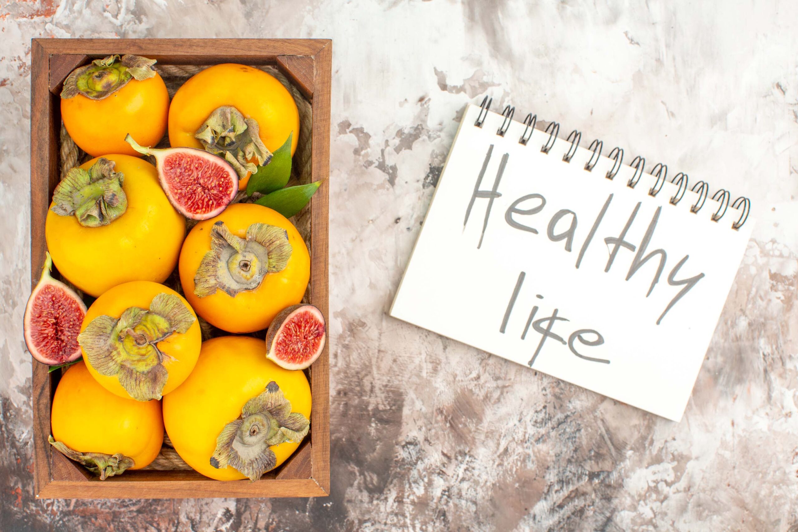 top view fresh persimmons figs in wooden box healthy life writte